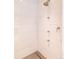This is a modern glass shower with tiled walls and shower head at 2260 S Jackson St, Denver, CO 80210