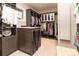 This walk-in closet has custom cabinets, drawers, hanging storage, and windows at 2260 S Jackson St, Denver, CO 80210