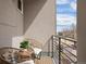 Cozy balcony featuring wicker chairs and a small table, offering a private outdoor space at 1256 Xavier St, Denver, CO 80204