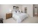 Neutral bedroom features plush carpeting, a queen bed, and artwork over the headboard at 1256 Xavier St, Denver, CO 80204