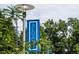 Sloan's Lake community sign surrounded by lush greenery showcasing the welcoming atmosphere at 1256 Xavier St, Denver, CO 80204