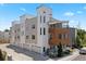 Modern townhome showcases a stylish exterior with contemporary design and multiple windows at 1256 Xavier St, Denver, CO 80204