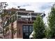 Odell Brewing building and rooftop terrace featuring brick facade, modern awning, and vibrant greenery at 1256 Xavier St, Denver, CO 80204