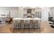 Modern kitchen featuring a large island with seating and stainless steel appliances at 1256 Xavier St, Denver, CO 80204