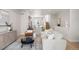 Bright, open-concept living room featuring modern decor and hardwood floors at 1256 Xavier St, Denver, CO 80204