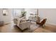 Cozy living room featuring modern furniture, a stylish rug, and plenty of natural light at 1256 Xavier St, Denver, CO 80204