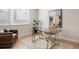 Bright office space with a modern glass desk, comfortable seating, and a decorative rug at 1256 Xavier St, Denver, CO 80204