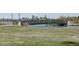 Scenic view of a walking bridge spanning a peaceful lake with the city skyline in the distance at 1256 Xavier St, Denver, CO 80204