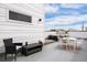 Chic rooftop deck with comfortable seating, table, and open layout offering relaxing outdoor enjoyment at 1256 Xavier St, Denver, CO 80204