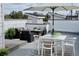 Inviting rooftop patio with a dining area and lounge seating, perfect for entertaining and relaxing outdoors at 1256 Xavier St, Denver, CO 80204