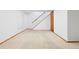 Unfinished basement with neutral carpet, white walls, stairs and a nearby closet for storage at 10894 Depew Pl, Westminster, CO 80020
