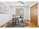 The bedroom includes a ceiling fan, a closet, a desk and hardwood floors with an area rug at 10894 Depew Pl, Westminster, CO 80020