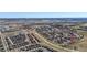 Extensive aerial shot showing the location of the property in its residential neighborhood with nearby amenities and green spaces at 2976 Open Sky Way, Castle Rock, CO 80109
