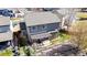 Overhead view of home's fenced yard with pergola-covered patio, outdoor grill, and professional landscaping at 2976 Open Sky Way, Castle Rock, CO 80109