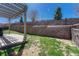 Backyard with patio and stone-walled landscaping at 2976 Open Sky Way, Castle Rock, CO 80109
