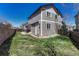 Well-maintained backyard featuring green grass and partial fencing at 2976 Open Sky Way, Castle Rock, CO 80109