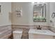 This bathroom features rustic style wainscoting, and decor at 2976 Open Sky Way, Castle Rock, CO 80109