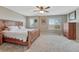 This bedroom features a wood bed frame, carpet, and two windows at 2976 Open Sky Way, Castle Rock, CO 80109