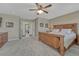 This bedroom features a wood bed frame, carpet, and a doorway into the next room at 2976 Open Sky Way, Castle Rock, CO 80109
