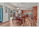 Inviting dining area with hardwood floors, sliding glass doors, and open access to the kitchen at 2976 Open Sky Way, Castle Rock, CO 80109