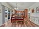 Bright dining area with hardwood floors, sliding glass doors, and open access to the kitchen at 2976 Open Sky Way, Castle Rock, CO 80109