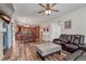 Spacious open-concept living area with hardwood floors, a dining area, and a glimpse of the kitchen at 2976 Open Sky Way, Castle Rock, CO 80109