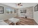 Bright living space features wood floors, modern furnishings, and media center with wall-mounted TV at 2976 Open Sky Way, Castle Rock, CO 80109
