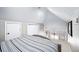 Charming bedroom with neutral paint, large bed, and sloped ceilings at 1421 Jasmine St, Denver, CO 80220