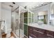 Modern bathroom with glass enclosed shower, sleek vanity, and coordinated decor at 2917 S Locust St, Denver, CO 80222