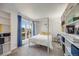 Comfortable bedroom with large window and built-in bookshelves at 2917 S Locust St, Denver, CO 80222