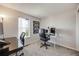 Bedroom with light colored walls and a view at 2917 S Locust St, Denver, CO 80222