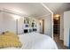Neutral bedroom featuring a canopy bed, built-in shelves, and closet at 2917 S Locust St, Denver, CO 80222