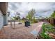 Fenced backyard area with basketball hoop, garden beds, and gravel landscaping at 18472 E Atlantic Dr, Aurora, CO 80013