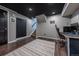 Finished basement features dark painted ceilings, updated flooring, and carpeted stairs at 18472 E Atlantic Dr, Aurora, CO 80013