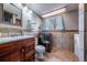 Bathroom featuring a modern vanity, new appliances, and gorgeous tile work at 18472 E Atlantic Dr, Aurora, CO 80013