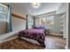 Cozy bedroom with hardwood floors, soft natural light, and a comfortable atmosphere at 18472 E Atlantic Dr, Aurora, CO 80013