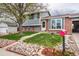 Charming house with well-maintained lawn and rock landscaping leading to a red mailbox and front door at 18472 E Atlantic Dr, Aurora, CO 80013