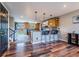 Spacious kitchen with an island, hardwood floors, and access to a back patio at 18472 E Atlantic Dr, Aurora, CO 80013