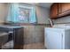 Clean laundry room featuring updated appliances and beautiful tile at 18472 E Atlantic Dr, Aurora, CO 80013