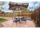 Cozy patio setup with table, chairs, and umbrella for outdoor dining and relaxation at 18472 E Atlantic Dr, Aurora, CO 80013