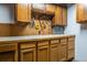 Workshop with ample wooden cabinetry and counter space for storage and projects at 18472 E Atlantic Dr, Aurora, CO 80013