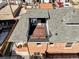 Aerial view of a brick home with a rooftop deck, providing an elevated outdoor living space and city views at 2931 W 20Th Ave, Denver, CO 80211