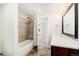 Bright bathroom featuring tiled shower-tub, granite vanity top, modern fixtures, and neutral color scheme at 2931 W 20Th Ave, Denver, CO 80211