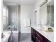 Modern bathroom with a soaking tub, glass shower, and stylish vanity at 2931 W 20Th Ave, Denver, CO 80211