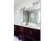 Bathroom showcases double vanity, modern lighting, large mirror, and glass-enclosed shower at 2931 W 20Th Ave, Denver, CO 80211