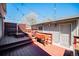 Spacious outdoor deck with multiple levels, built-in seating, and overhead string lights at 2931 W 20Th Ave, Denver, CO 80211