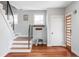 Warm entryway featuring hardwood floors, staircase, and tastefully decorated interiors at 2931 W 20Th Ave, Denver, CO 80211