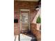 Modern front door with sleek horizontal windows, complemented by brick accents and stylish house numbers at 2931 W 20Th Ave, Denver, CO 80211