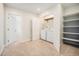 Convenient laundry area with a washer, dryer, built-in shelving, and easy access to other rooms at 2931 W 20Th Ave, Denver, CO 80211