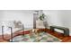 Stylish living room with hardwood floors, modern seating, and neutral decor with a patterned rug at 2931 W 20Th Ave, Denver, CO 80211